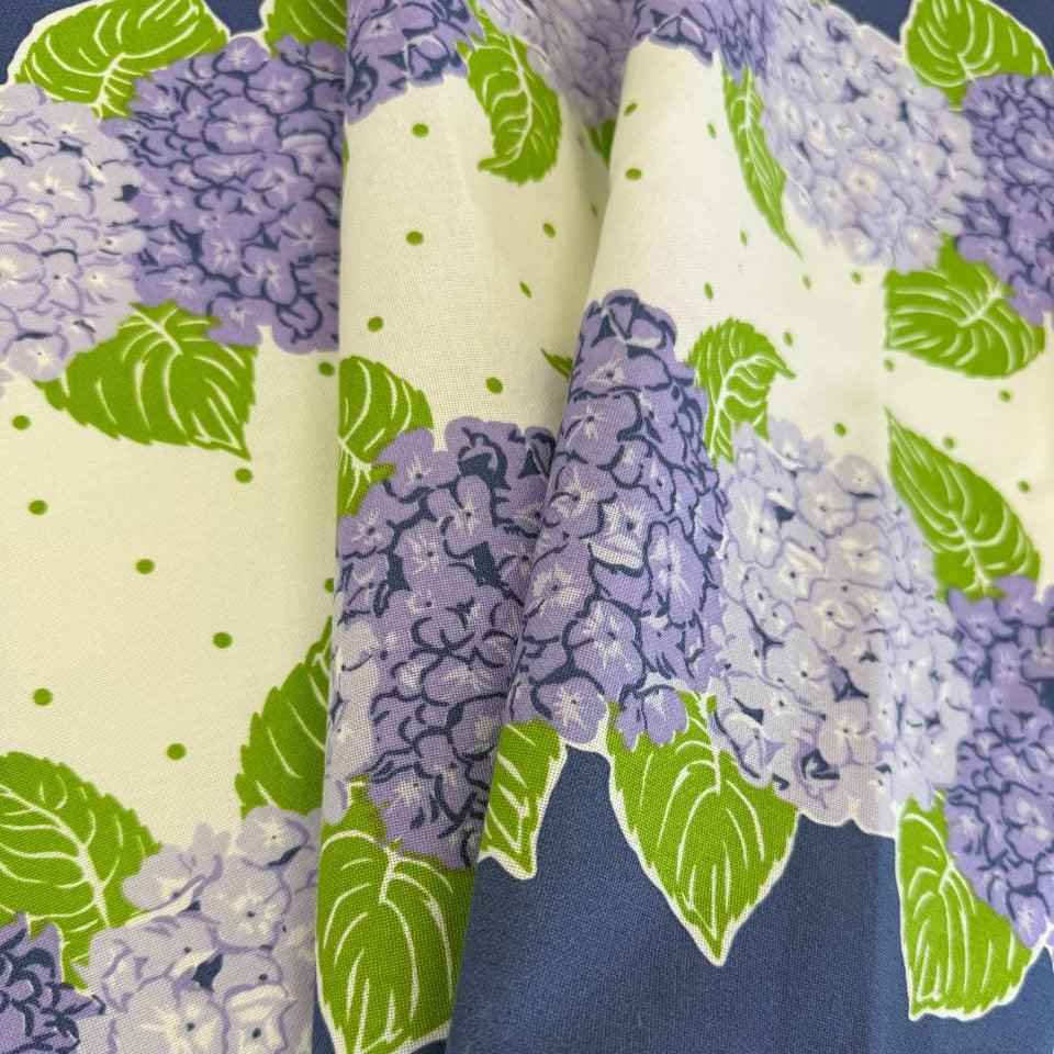 Classic Retro cotton toweling with blue and lavender hydrangeas, green leaves and blue border.