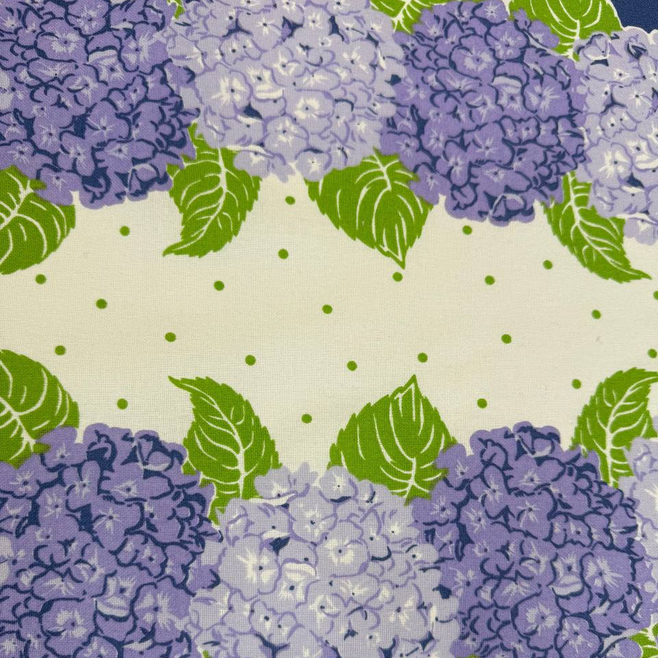 Classic Retro cotton toweling with blue and lavender hydrangeas, green leaves and blue border.