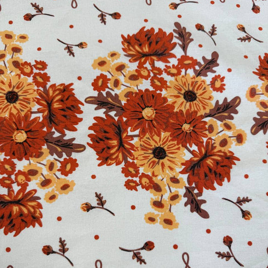 Classic Retro 100% cotton toweling with rust orange and golden floral bouquets, cream centre and rust border.