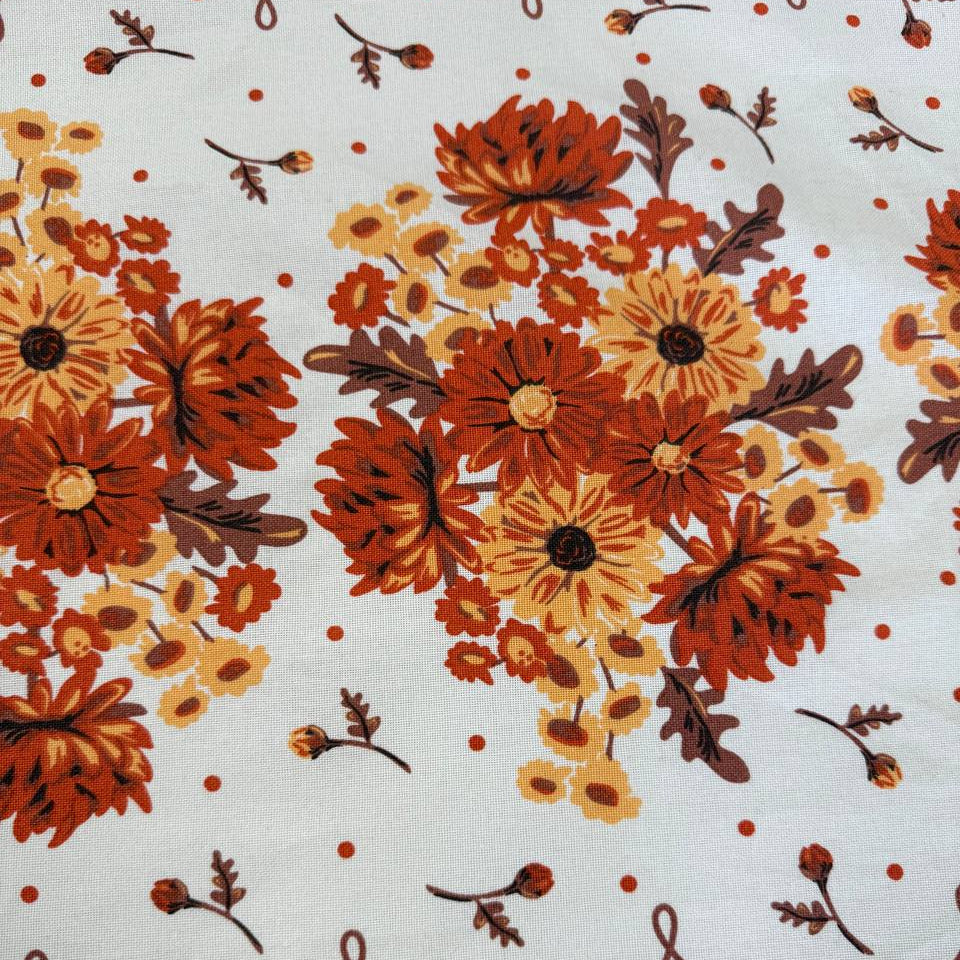 Classic Retro 100% cotton toweling with rust orange and golden floral bouquets, cream centre and rust border.