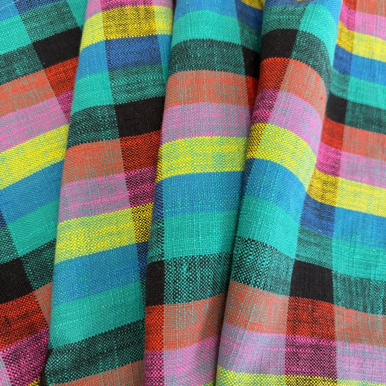 Sunshine 100% cotton woven toweling with colourful turquoise, blue, yellow, pink, orange and black plaid pattern.