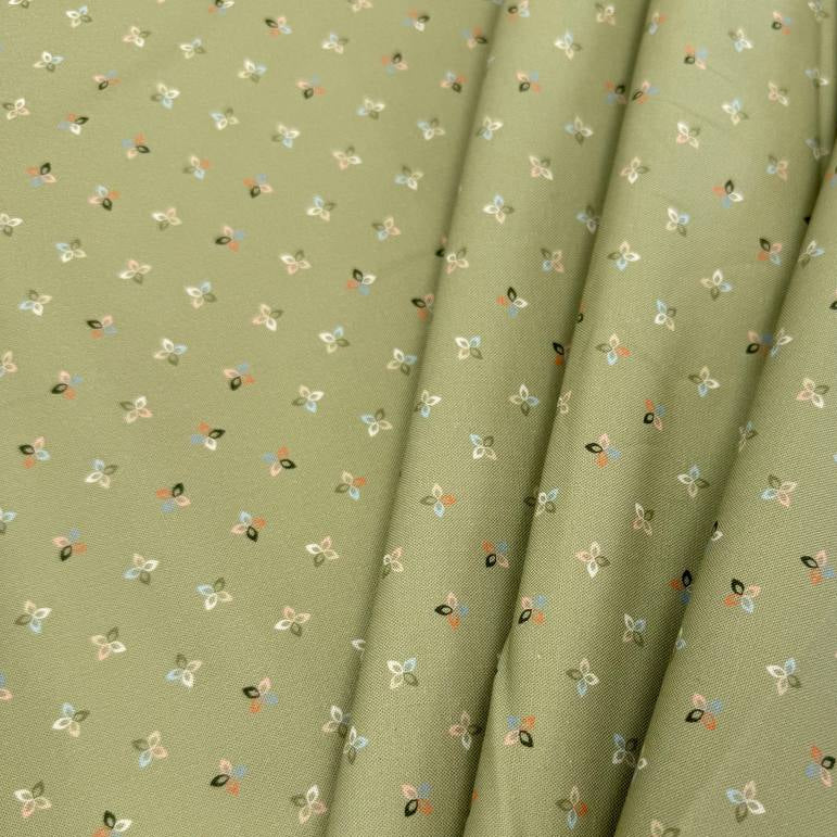 Petalush Meadow sage green cotton fabric by Kiley's Quilt Room for Moda Fabrics, featuring tiny white, peach and blue floral motifs.