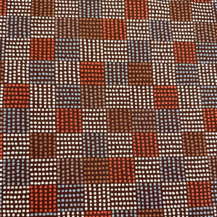Nature’s Sketchbook by Elena Amo for Moda Fabrics in Bark, dark brown fabric with geometric dotted rectangles in blue, cream and rust orange.