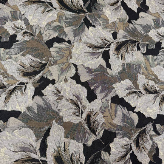 Beige fancy jacquard fabric featuring an elegant woven leaf pattern in grey, taupe and black with subtle metallic accents.