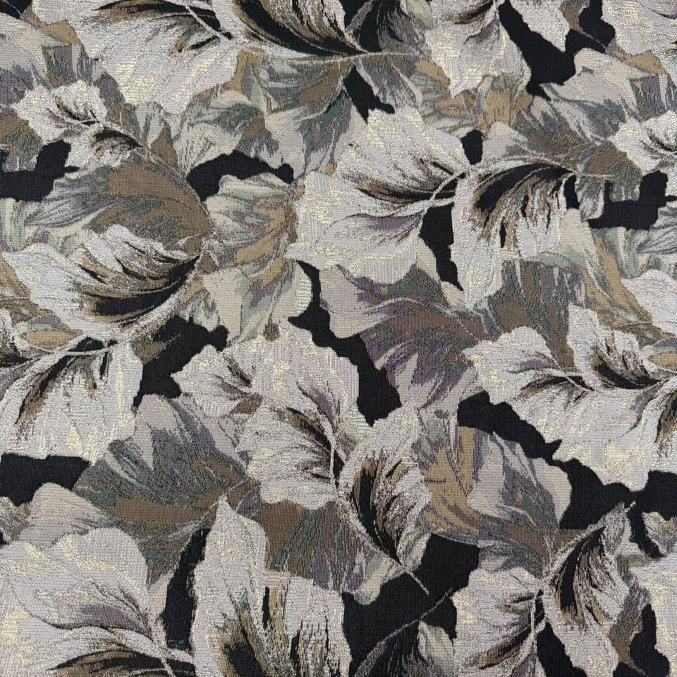Beige fancy jacquard fabric featuring an elegant woven leaf pattern in grey, taupe and black with subtle metallic accents.