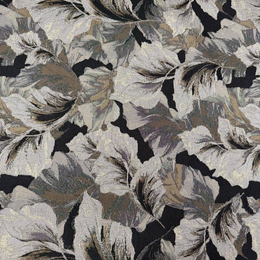 Beige fancy jacquard fabric featuring an elegant woven leaf pattern in grey, taupe and black with subtle metallic accents.