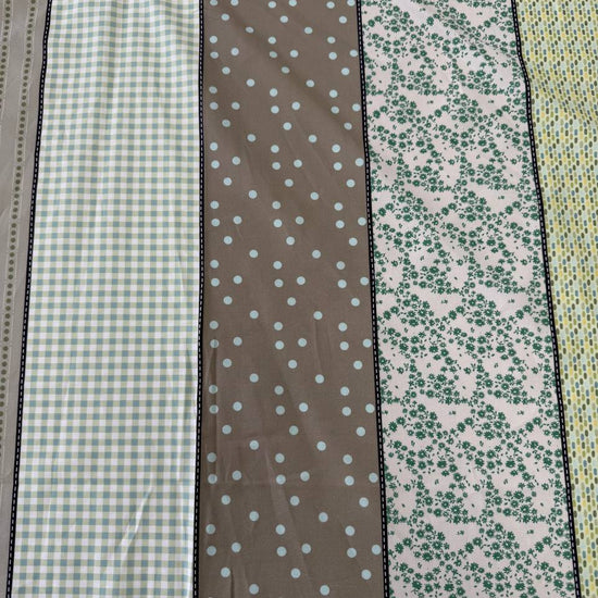 Moda Gathered Lollies Trentham One cotton fabric featuring vertical stripes with floral, gingham and dotted patterns in sage green, olive, beige and cream.