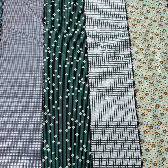 Gathered Lollies Moda cotton fabric featuring vertical patchwork-inspired stripes with floral, gingham and geometric patterns in teal, sage green, mint, blue and beige.
