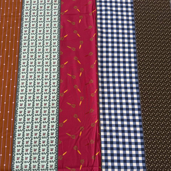 Gathered Lollies cotton fabric by Jen Kingwell for Moda featuring colourful vertical stripes with gingham, floral and geometric patterns in teal, rust, red, navy, brown and cream.