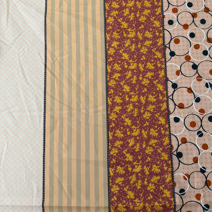 Gathered Lollies cotton fabric by Jen Kingwell for Moda featuring vertical patchwork-inspired stripes with floral and geometric prints in peach, terracotta, burgundy, cream and teal.
