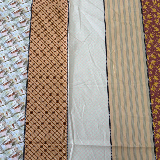 Gathered Lollies cotton fabric by Jen Kingwell for Moda featuring vertical patchwork-inspired stripes with floral and geometric prints in peach, terracotta, burgundy, cream and teal.