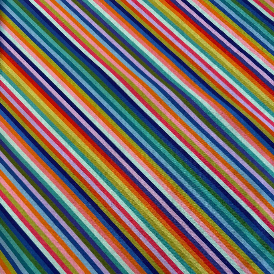 100% cotton quilting fabric from the Animal Alphabet collection by Lewis & Irene featuring colorful diagonal rainbow stripes on a white background.