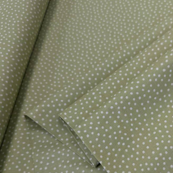 Story Book Dots quilting cotton fabric in green with delicate white dotted pattern, 100% cotton, 45 inch wide.