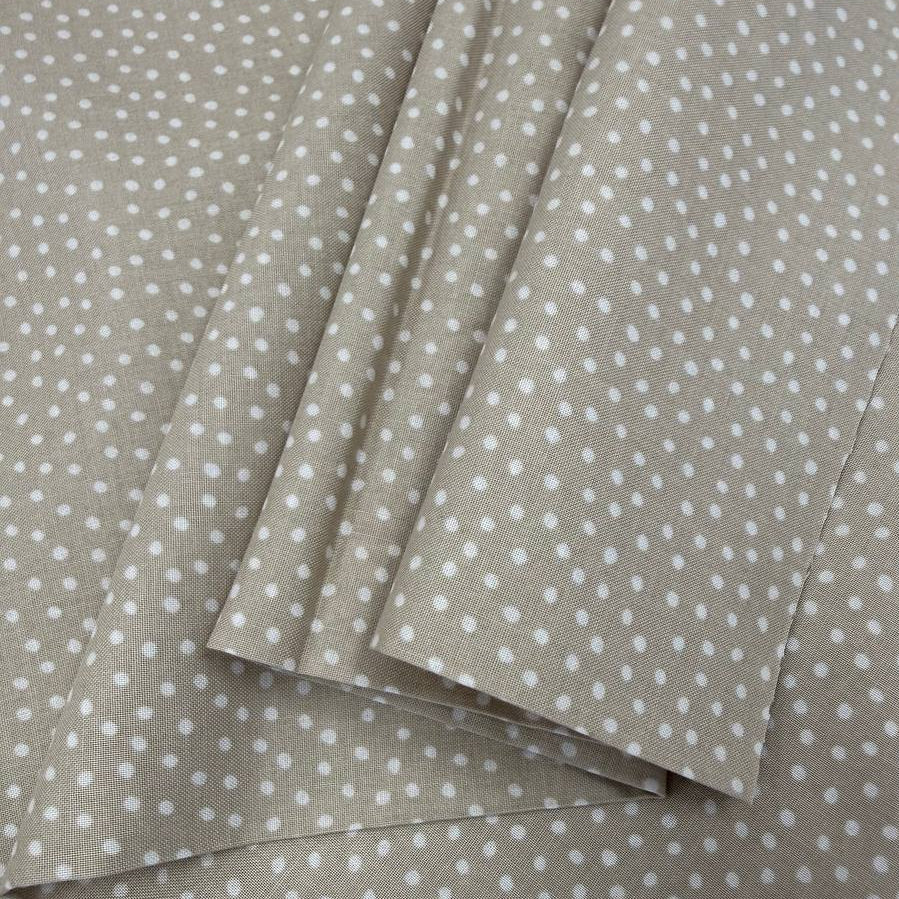 Story Book Dots quilting cotton fabric in taupe with delicate white dotted pattern, 100% cotton, 45 inch wide.
