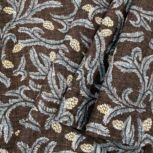 Brown quilting cotton fabric with blue leafy floral vines and cream pinecone print, 100% cotton, 45 inch wide