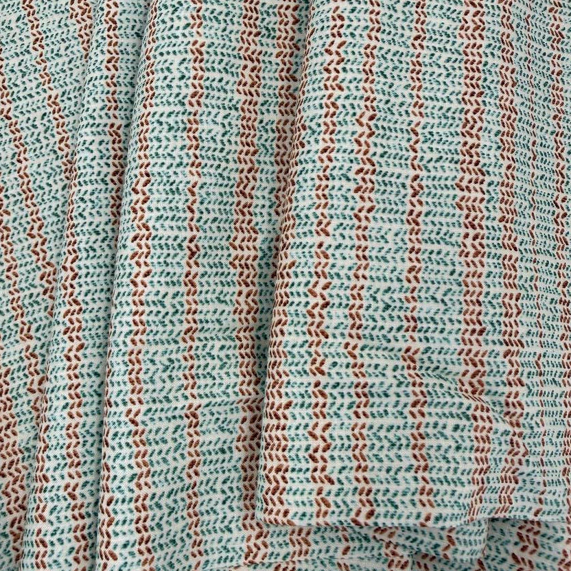 100% cotton quilting fabric featuring textured sage green and brown vertical stripes on a white background, 45 inch wide.