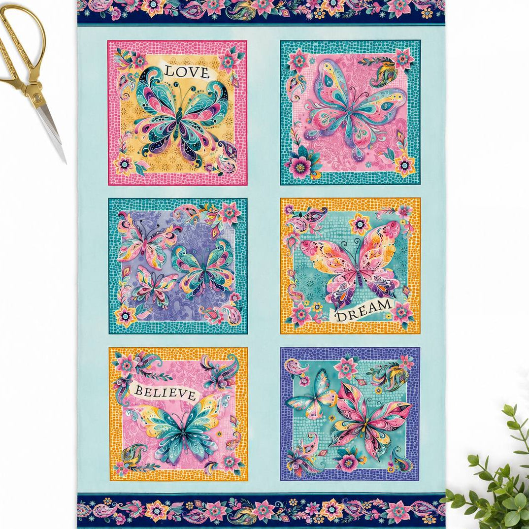 Faith & Grace Boxes Multi cotton fabric panel by Kanvas Studio for Benartex featuring six colorful butterfly blocks with floral and paisley designs on a light aqua background.