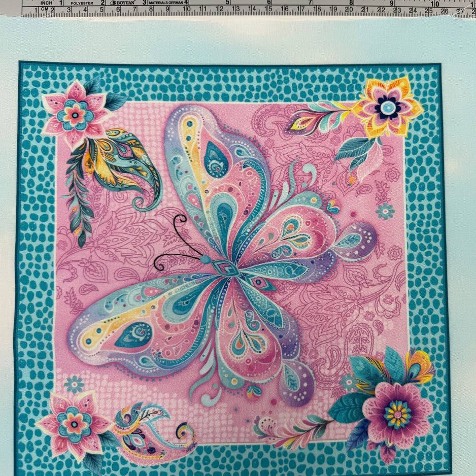 Faith & Grace Boxes Multi cotton fabric panel by Kanvas Studio for Benartex featuring six colorful butterfly blocks with floral and paisley designs on a light aqua background.