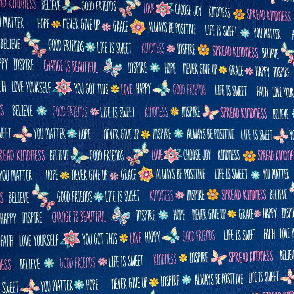 Navy blue 100% cotton quilting fabric featuring colorful inspirational words, butterflies, and flowers from the Faith & Grace collection by Kanvas Studio for Benartex.