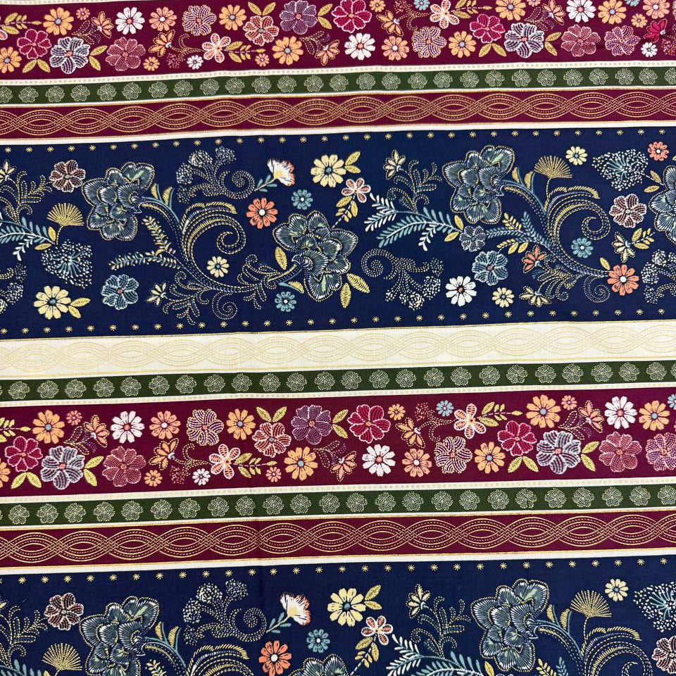 Majestic Garden Metallic Border Stripe quilting cotton by Kanvas Studio featuring decorative floral border stripes with metallic gold accents on a navy background.