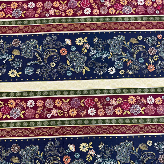 Majestic Garden Metallic Border Stripe quilting cotton by Kanvas Studio featuring decorative floral border stripes with metallic gold accents on a navy background.