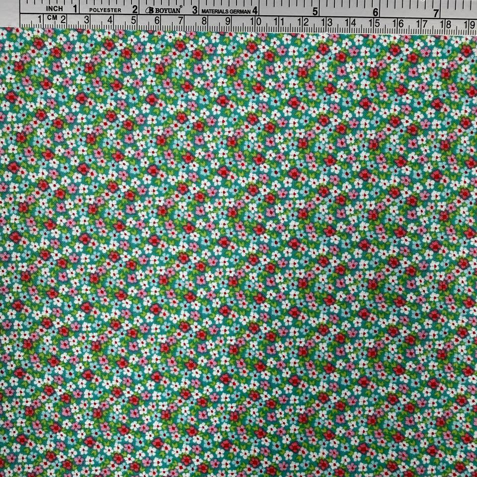 Smitten Chicken Flower Patch quilting cotton fabric by Poppie Cotton featuring tiny red, pink, and white flowers with green foliage scattered across a soft aqua background.