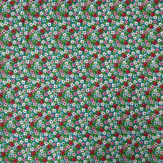 Smitten Chicken Flower Patch quilting cotton fabric by Poppie Cotton featuring tiny red, pink, and white flowers with green foliage scattered across a soft aqua background.