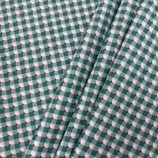 Smitten Chicken Check-A-Roo quilting cotton fabric by Poppie Cotton featuring a small gingham check with tiny white floral accents, available in Aqua and Pink.