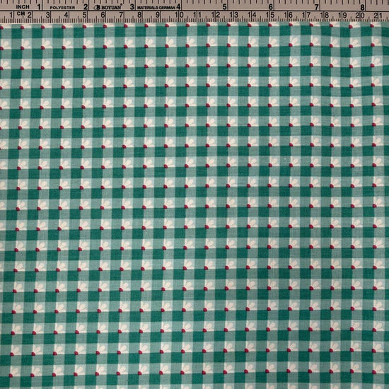Smitten Chicken Check-A-Roo quilting cotton fabric by Poppie Cotton featuring a small gingham check with tiny white floral accents, available in Aqua and Pink.