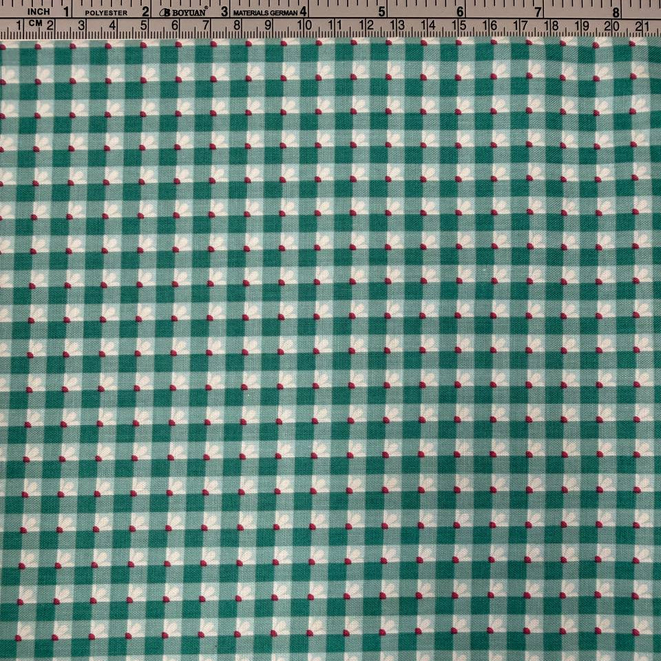 Smitten Chicken Check-A-Roo quilting cotton fabric by Poppie Cotton featuring a small gingham check with tiny white floral accents, available in Aqua and Pink.