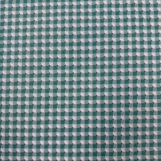 Smitten Chicken Check-A-Roo quilting cotton fabric by Poppie Cotton featuring a small gingham check with tiny white floral accents, available in Aqua and Pink.
