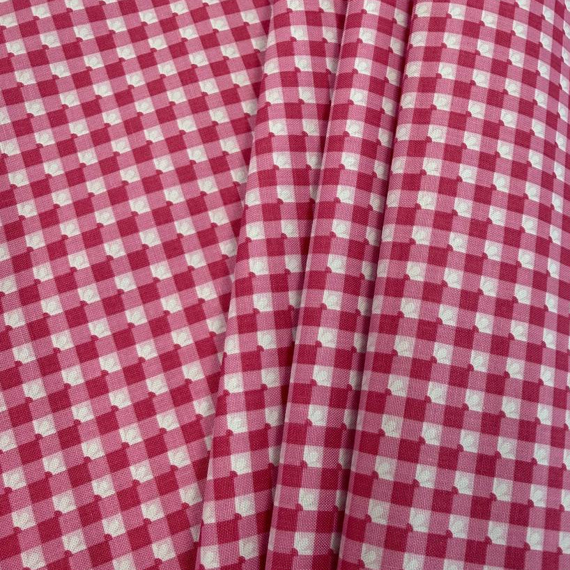 Smitten Chicken Check-A-Roo quilting cotton fabric by Poppie Cotton featuring a small gingham check with tiny white floral accents, available in Aqua and Pink.