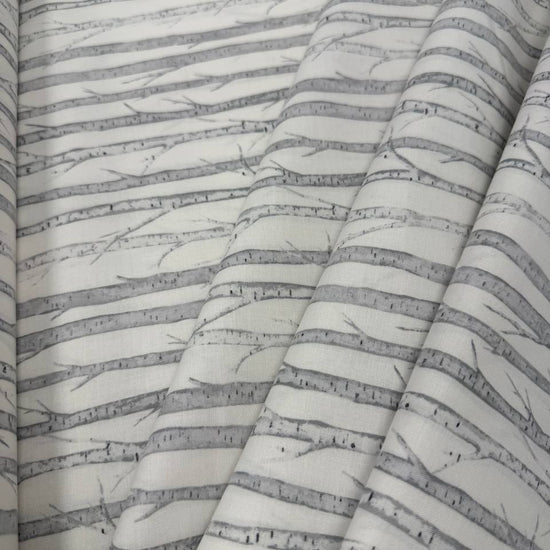 Tanglewood White Multi 100% cotton fabric featuring layered grey tree branches on a white background, product code 29286-10