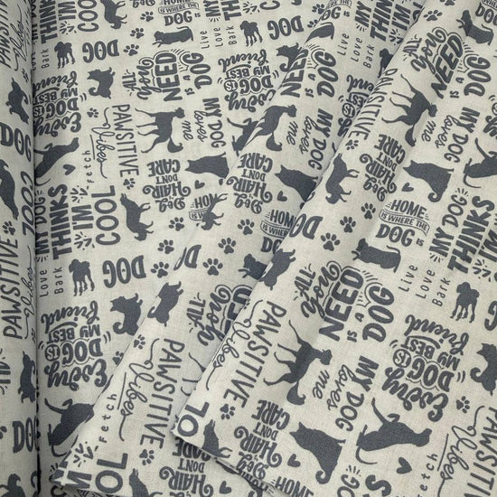 Always By My Side Blue 100% cotton fabric featuring dog silhouettes, paw prints and playful dog-themed phrases on a light background, product code 91328-40.