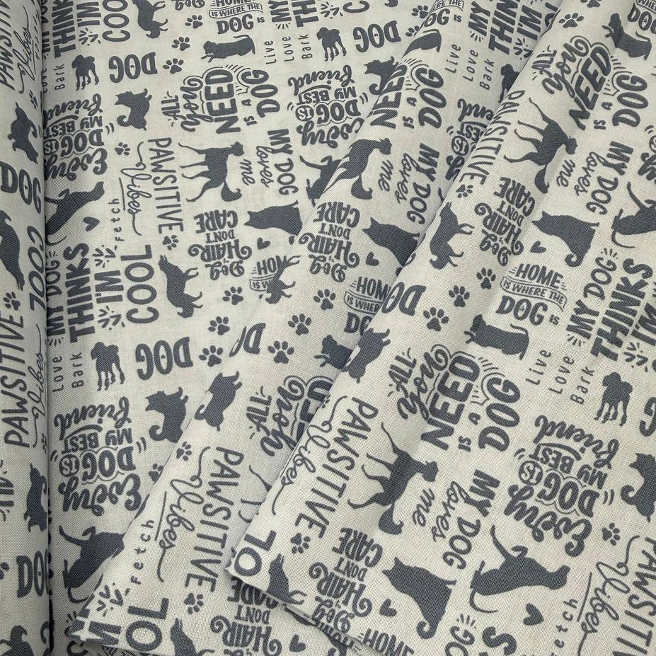 Always By My Side Blue 100% cotton fabric featuring dog silhouettes, paw prints and playful dog-themed phrases on a light background, product code 91328-40.