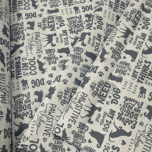 Always By My Side Blue 100% cotton fabric featuring dog silhouettes, paw prints and playful dog-themed phrases on a light background, product code 91328-40.