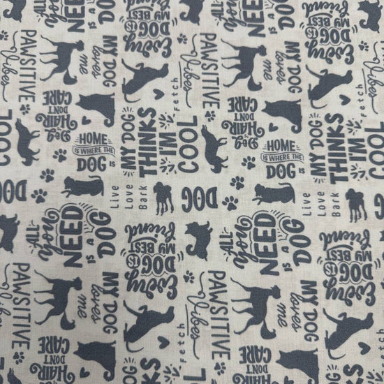 Always By My Side Blue 100% cotton fabric featuring dog silhouettes, paw prints and playful dog-themed phrases on a light background, product code 91328-40.