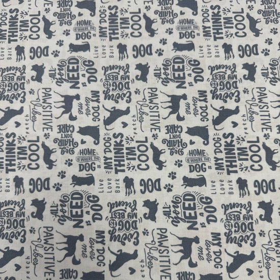 Always By My Side Blue 100% cotton fabric featuring dog silhouettes, paw prints and playful dog-themed phrases on a light background, product code 91328-40.