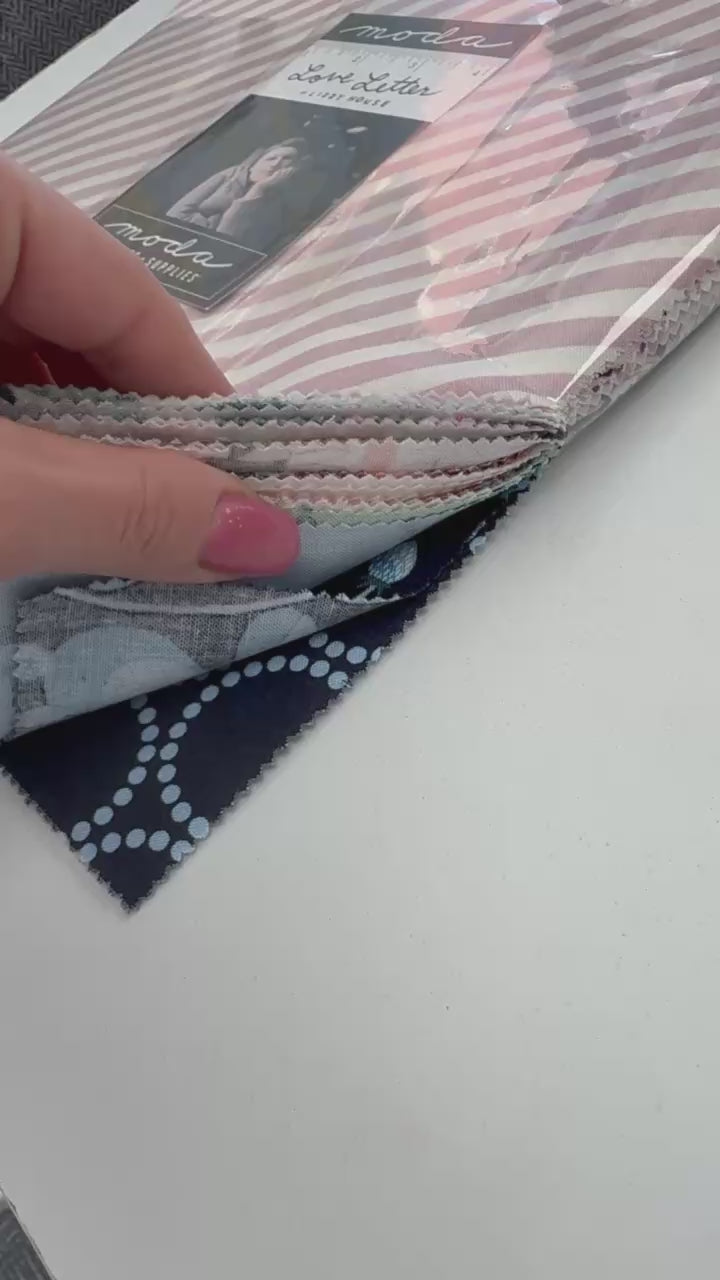Love Letters Layer Cake quilting fabric bundle by Moda Fabrics with pink diagonal stripe pattern