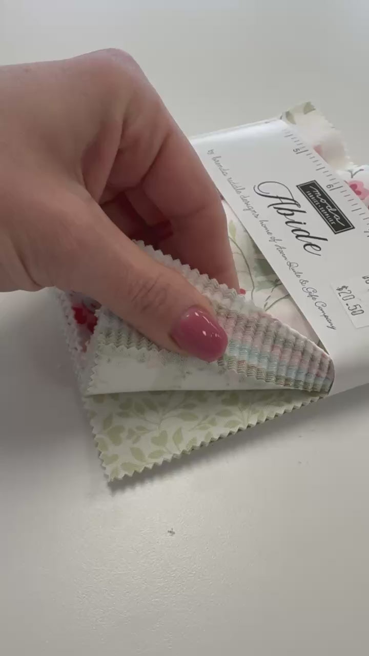 Abide Charm Pack by Brenda Riddle Designs for Moda Fabrics with soft pink floral quilting cotton prints