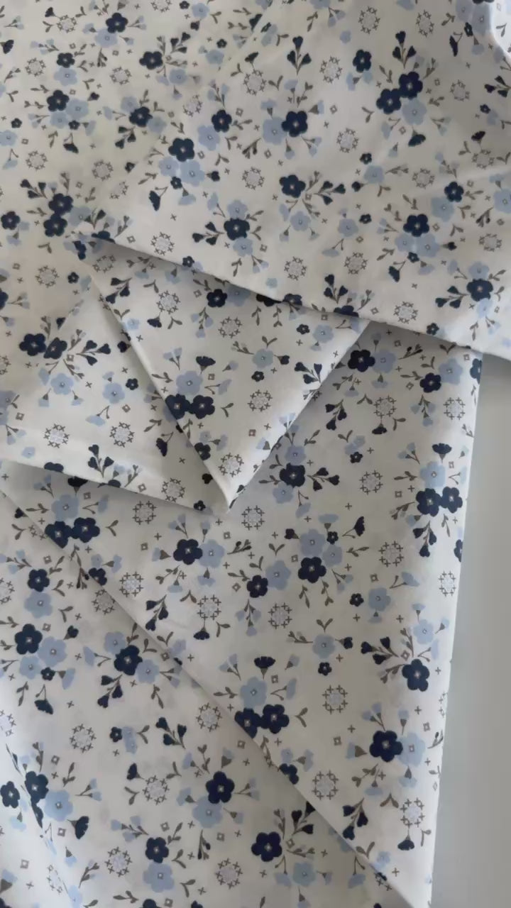 Blue floral cotton fabric by Moda Sun Drenched collection on cream background
