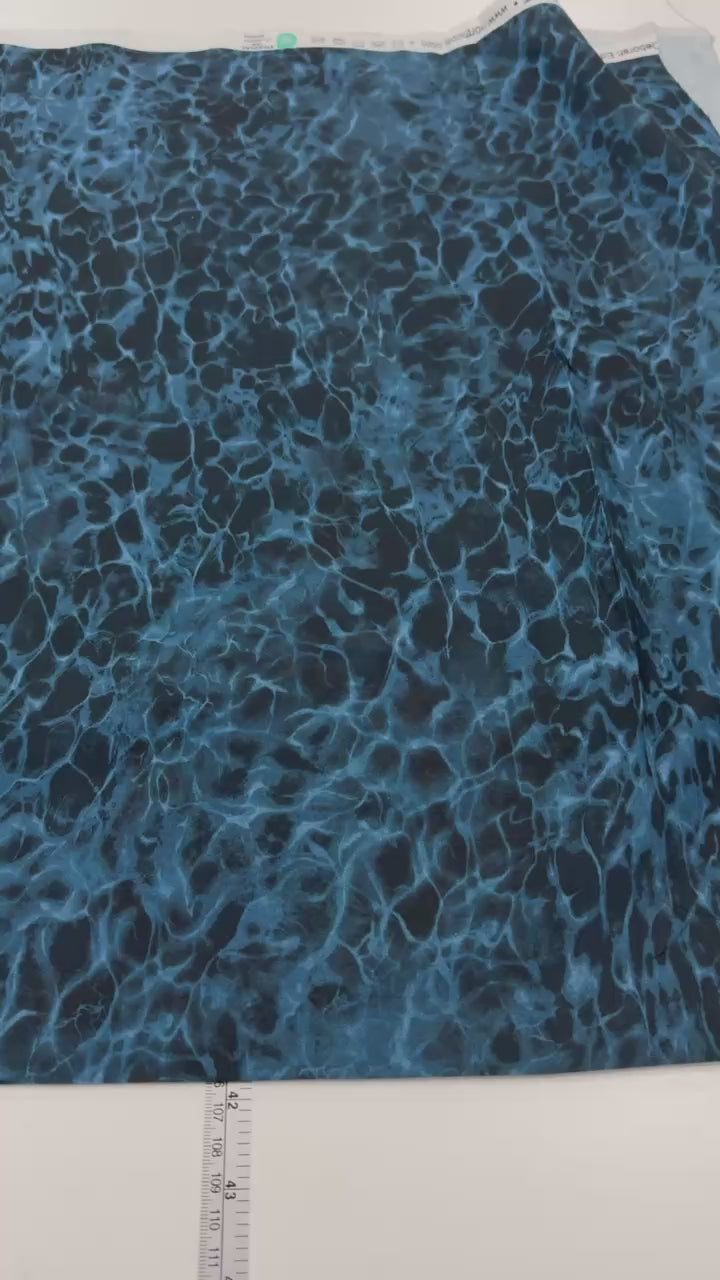 Northcott Naturescapes Voyage Still Water blue multi 100% cotton fabric with deep blue and turquoise water texture.