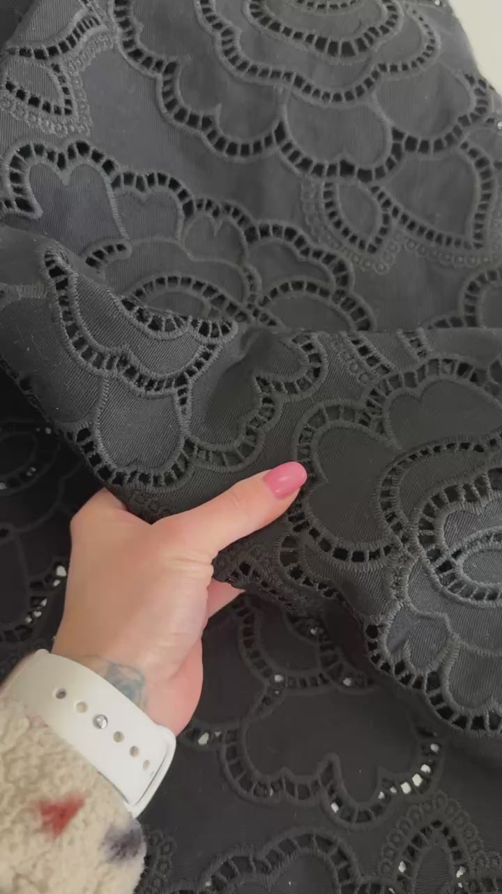Black cut out lace fabric with floral eyelet pattern