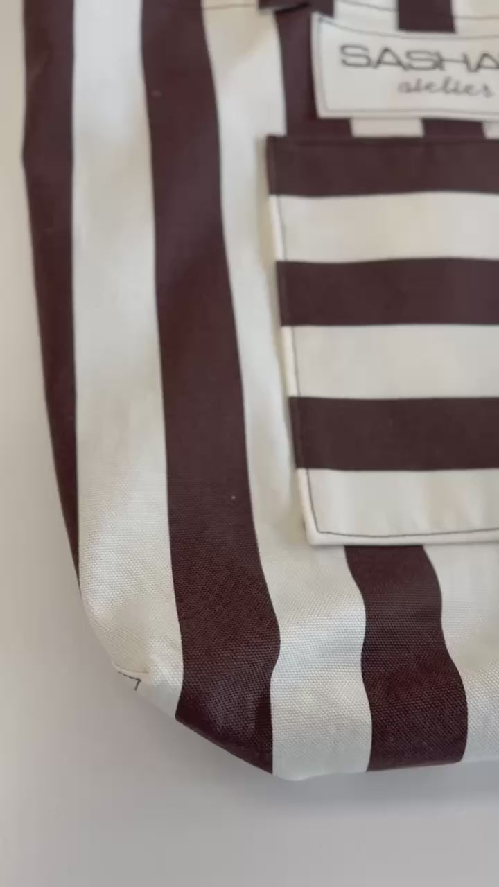 Handmade striped canvas tote bag with a large front exterior pocket, comfortable shoulder straps, and Sasha's Atelier label. Durable canvas construction, proudly made in Canada, perfect for shopping, work, travel, and everyday use.