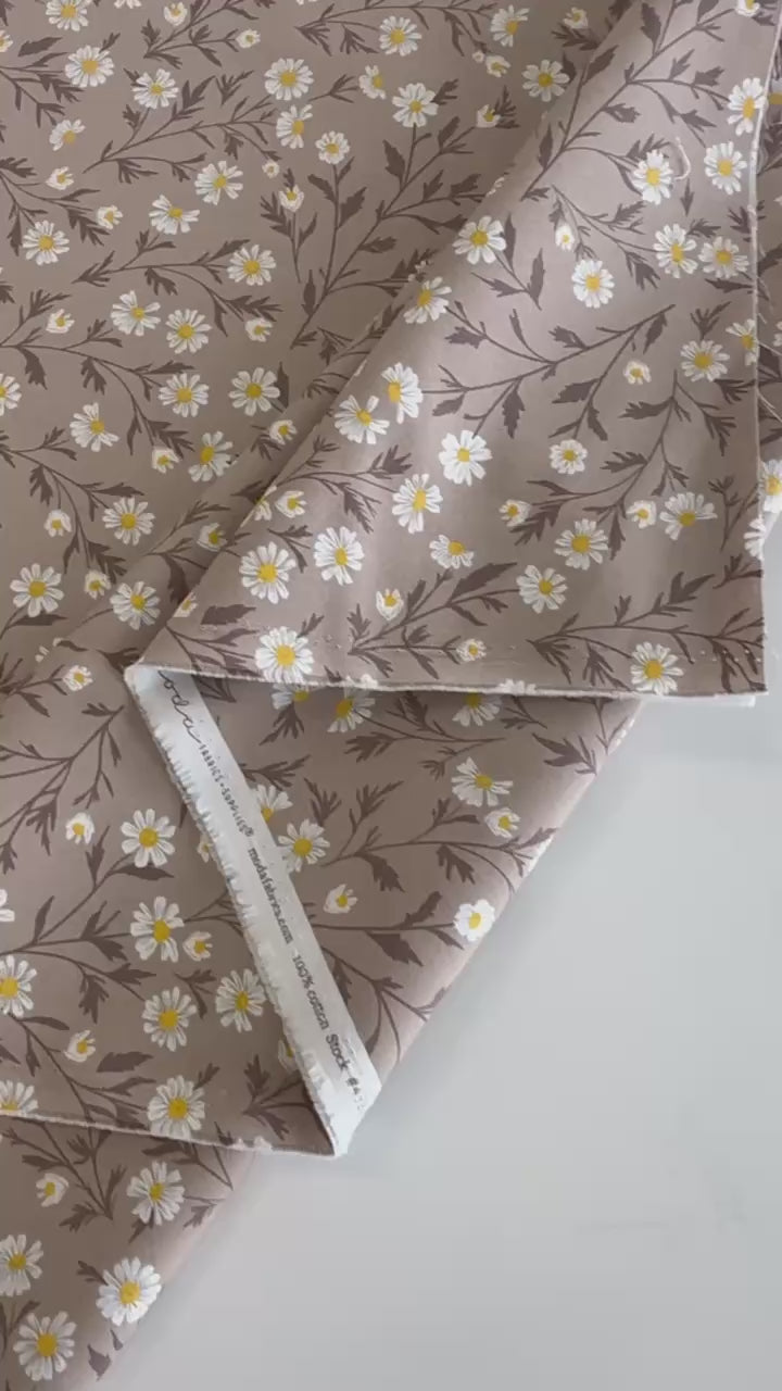 Beige cotton fabric with white daisy floral print
